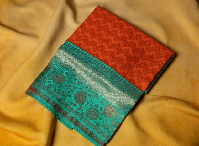 Vibrant Sunset Orange & Teal Kanchipuram Silk Saree.