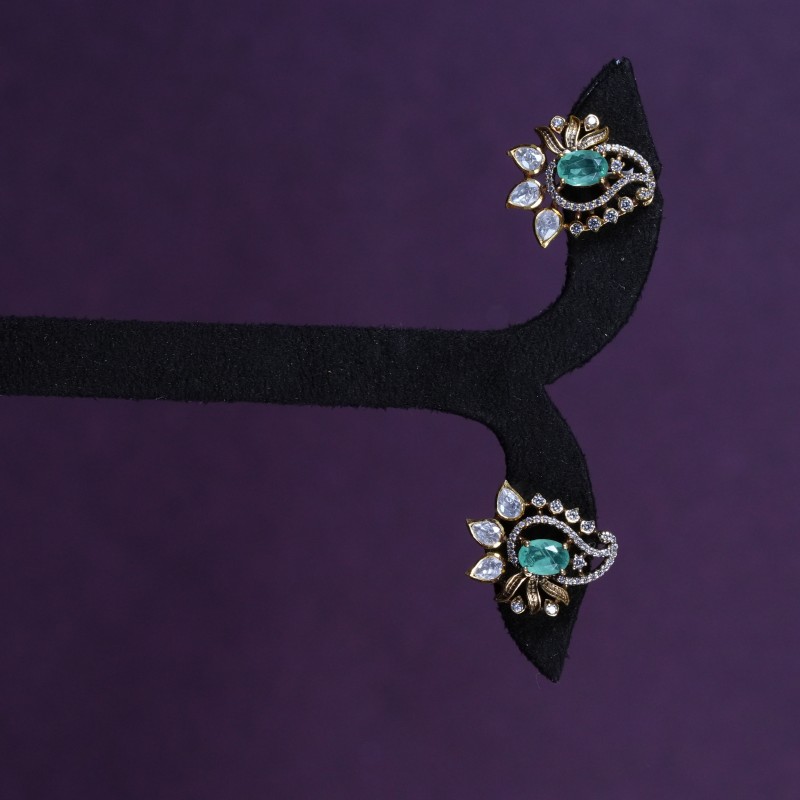Emerald American Diamond Swirl Statement Stud Earrings