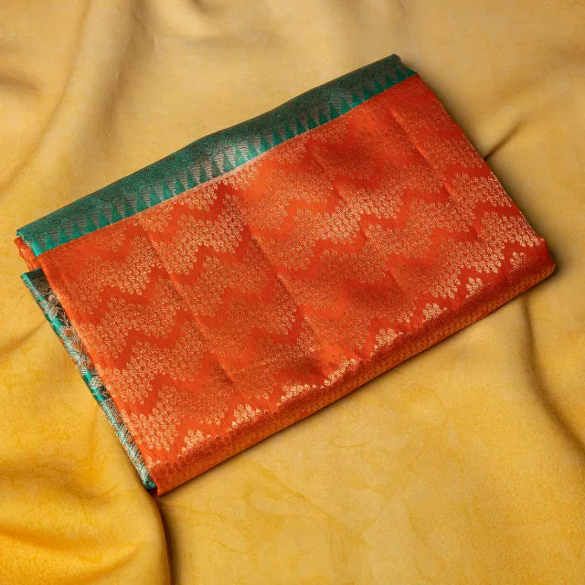 Vibrant Sunset Orange & Teal Kanchipuram Silk Saree.